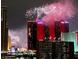 Spectacular view of city buildings with vibrant fireworks display in the night sky at 200 W Sahara Ave # 801, Las Vegas, NV 89102