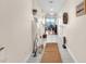 Bright hallway with neutral colors featuring a view into the dining room and an outdoor balcony at 200 W Sahara Ave # 801, Las Vegas, NV 89102