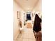 Inviting hallway with neutral tones, tiled flooring, and decorative accents leading to the dining area at 200 W Sahara Ave # 801, Las Vegas, NV 89102