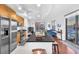 Kitchen featuring stainless steel appliances, a kitchen island with seating, and an adjacent living room at 200 W Sahara Ave # 801, Las Vegas, NV 89102