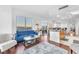Bright living room featuring hardwood floors, modern furniture, and expansive windows with city views at 200 W Sahara Ave # 801, Las Vegas, NV 89102