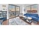 Cozy living room featuring balcony access and city views at 200 W Sahara Ave # 801, Las Vegas, NV 89102