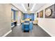 Modern lobby area with stylish blue accents, unique wall art and a chandelier at 200 W Sahara Ave # 801, Las Vegas, NV 89102