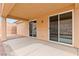 Covered back patio with dual sliding glass door access to the interior and view of backyard at 2150 Grant Union Ct, Laughlin, NV 89029