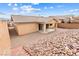Low-maintenance backyard with desert landscaping and covered patio offering space for outdoor entertaining at 2150 Grant Union Ct, Laughlin, NV 89029