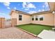 Low-maintenance backyard featuring artificial grass and gravel landscaping at 2150 Grant Union Ct, Laughlin, NV 89029