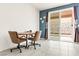 Cozy dining area with a table and chairs, complemented by a sliding glass door at 2150 Grant Union Ct, Laughlin, NV 89029