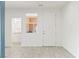 Spacious entryway with neutral tile floors, a bathroom view, and access to the front door at 2150 Grant Union Ct, Laughlin, NV 89029
