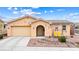 Charming single-story home featuring desert landscaping and cozy front porch swing at 2150 Grant Union Ct, Laughlin, NV 89029