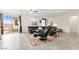 Spacious living room featuring tile flooring, a comfortable leather sofa, and sliding glass doors at 2150 Grant Union Ct, Laughlin, NV 89029