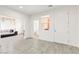 Tile floor and neutral walls create a bright and inviting living space with bathroom access at 2150 Grant Union Ct, Laughlin, NV 89029