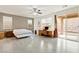 Spacious primary bedroom with a ceiling fan, slider, and neutral color palette at 2150 Grant Union Ct, Laughlin, NV 89029