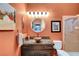 Bathroom showcasing a unique copper vessel sink, granite countertop, and a framed art piece at 2264 Pacini Ct, Henderson, NV 89052