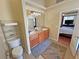 Bathroom features a double sink vanity, granite countertops, and wood cabinets at 2300 S Washoe Ave, Pahrump, NV 89048