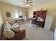 Bedroom with neutral carpet, ceiling fan, sofa and desk at 2300 S Washoe Ave, Pahrump, NV 89048