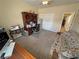 Carpeted bedroom with desk and sofa at 2300 S Washoe Ave, Pahrump, NV 89048