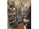 Walk-in closet with clothing, shoes, and assorted storage on shelving and racks at 2300 S Washoe Ave, Pahrump, NV 89048