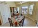 Dining nook with floral accents, natural light, a view of mountains, and access to a pantry and laundry room at 2300 S Washoe Ave, Pahrump, NV 89048