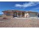 Charming single-story home with desert landscaping, covered porch, and a two-car attached garage at 2300 S Washoe Ave, Pahrump, NV 89048