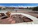 Front yard landscaping with rock cover, decorative rock features and water fountain at 2300 S Washoe Ave, Pahrump, NV 89048
