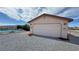 Exterior image of a detached garage with a wide door, offering plenty of space for vehicles or storage at 2300 S Washoe Ave, Pahrump, NV 89048