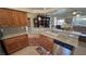 Spacious kitchen featuring oak cabinets, granite counters, and stainless steel appliances at 2300 S Washoe Ave, Pahrump, NV 89048