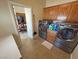 Laundry room with front load washer and dryer and doorway to kitchen at 2300 S Washoe Ave, Pahrump, NV 89048