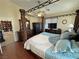 The main bedroom features a four-poster bed, wood floors, and a walk-in closet at 2300 S Washoe Ave, Pahrump, NV 89048
