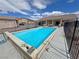 Inviting backyard pool with clear blue water, perfect for relaxation and entertaining on sunny days at 2300 S Washoe Ave, Pahrump, NV 89048