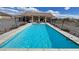 Backyard pool surrounded by fence at 2300 S Washoe Ave, Pahrump, NV 89048