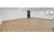 Expansive living room with wood floors, modern lighting, and a fireplace at 2521 Richfield Blvd, Las Vegas, NV 89102