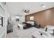 Spacious main bedroom with a wood panel accent wall, walk-in closet, and a seating area at 2521 Richfield Blvd, Las Vegas, NV 89102