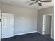 Neutral bedroom showcasing plush carpeting and ceiling fan at 2530 S Tecumseh Ave, Pahrump, NV 89048