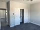 This bedroom features plush carpeting and a spacious closet with sliding doors at 2530 S Tecumseh Ave, Pahrump, NV 89048