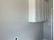 The laundry room features white cabinets, offering storage solutions and easy access to laundry hookups at 2530 S Tecumseh Ave, Pahrump, NV 89048
