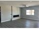 The living room features modern decor, a sleek fireplace, and a large window for plenty of natural light at 2530 S Tecumseh Ave, Pahrump, NV 89048