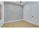 Neutral bedroom with wood floors and light gray accent wall at 2621 Spalding Dr, Las Vegas, NV 89134