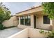 Private courtyard entry with desert landscaping and stucco walls at 2714 Bridgepointe Dr, Las Vegas, NV 89121