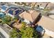 Overhead view of a backyard with a patio, lush landscaping, and neighboring houses at 2743 Carolina Blue Ave, Henderson, NV 89052