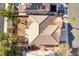 Aerial view of backyard with landscaping, desert rock, private pool and solar panels on the roof at 2743 Carolina Blue Ave, Henderson, NV 89052