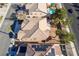 An aerial view of a home with a tile roof, desert landscaping, and palm trees at 2743 Carolina Blue Ave, Henderson, NV 89052