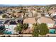 Real estate showcasing backyard pool, covered patio, lush landscaping, and neighboring houses at 2743 Carolina Blue Ave, Henderson, NV 89052