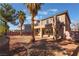 A spacious backyard features covered patio, drought tolerant landscaping, and private balcony at 2743 Carolina Blue Ave, Henderson, NV 89052