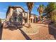 Landscaped backyard features drought-tolerant desert landscaping and second story balcony at 2743 Carolina Blue Ave, Henderson, NV 89052