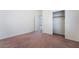 Neutral bedroom features carpet flooring, closet with sliding doors and bright white walls at 2743 Carolina Blue Ave, Henderson, NV 89052