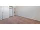 Bright bedroom with neutral carpet, white walls, and a closet for storage at 2743 Carolina Blue Ave, Henderson, NV 89052
