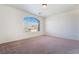 Large carpeted bedroom with a window at 2743 Carolina Blue Ave, Henderson, NV 89052