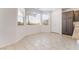 Bright breakfast nook with tile floors and large windows, adjacent to kitchen pantry and storage at 2743 Carolina Blue Ave, Henderson, NV 89052