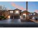 Charming two-story home featuring a three-car garage and inviting front entrance, perfect for a growing Gathering at 2743 Carolina Blue Ave, Henderson, NV 89052