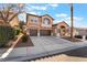 Charming two-story home with a three-car garage and well-maintained front yard in a sunny neighborhood at 2743 Carolina Blue Ave, Henderson, NV 89052